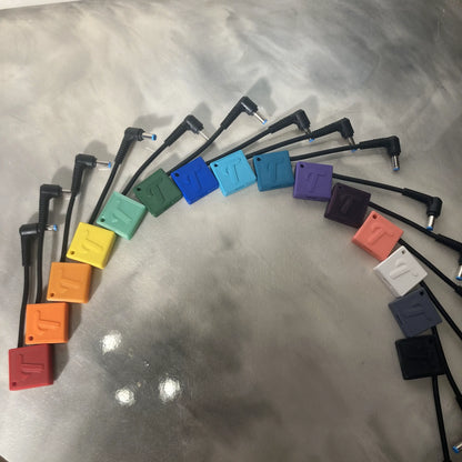 15 different colors of Tubie Tech USB-C charging adapters for Kangaroo Joey enteral pumps