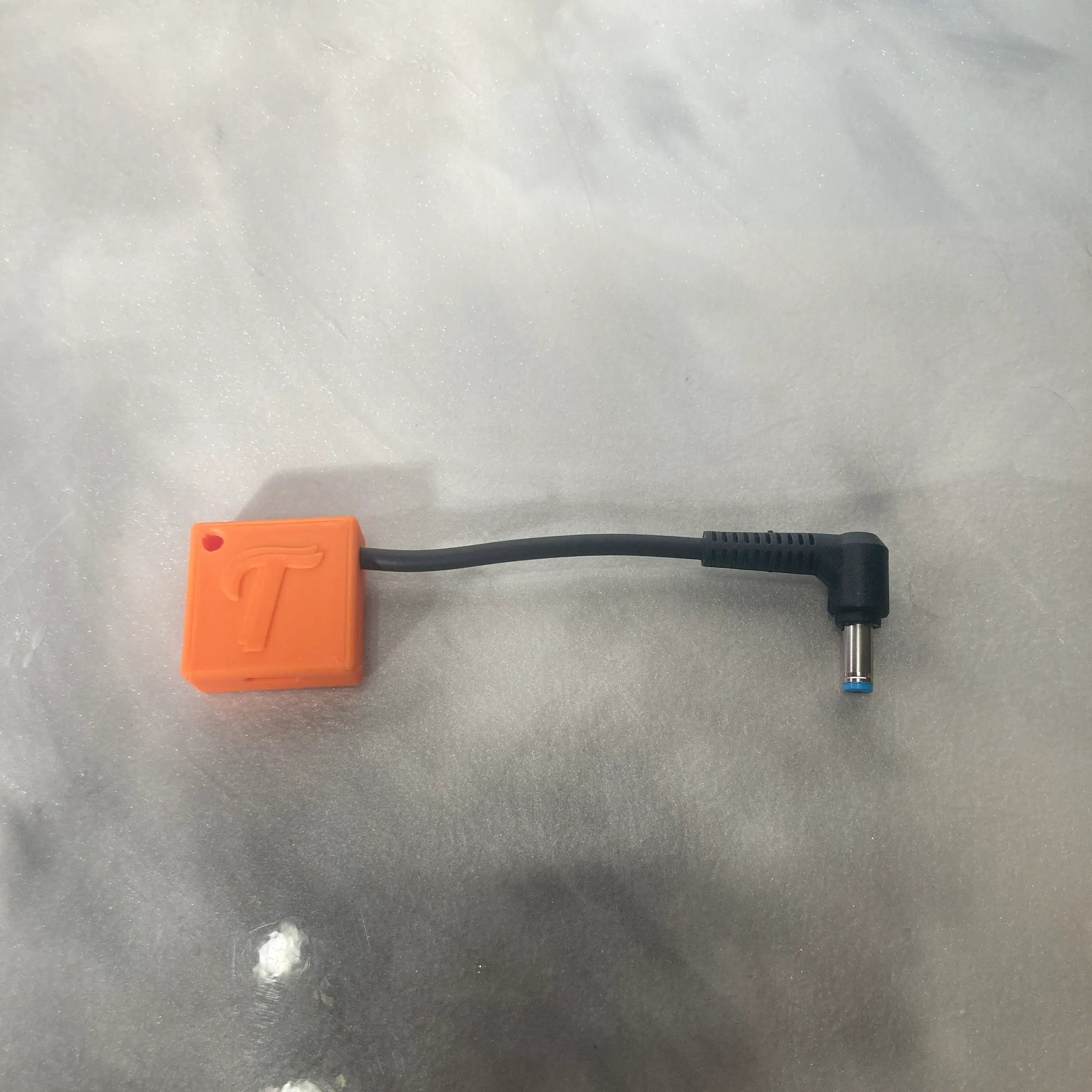 Tubie Tech charger for Kangaroo Joey Enteral Pumps in orange